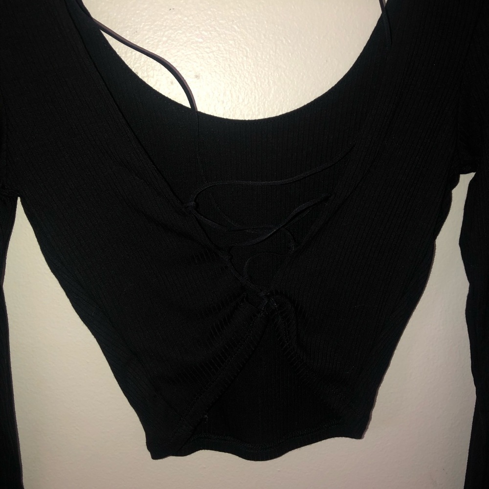 long sleeve shirt, back has a crisscross design